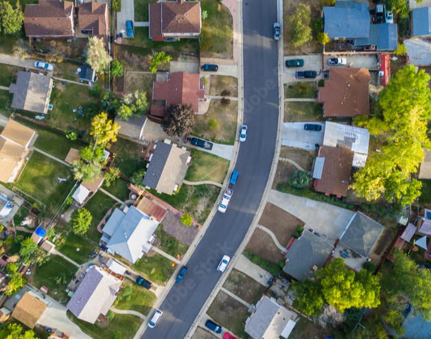 An aerial photo of a neighborhood is featured.